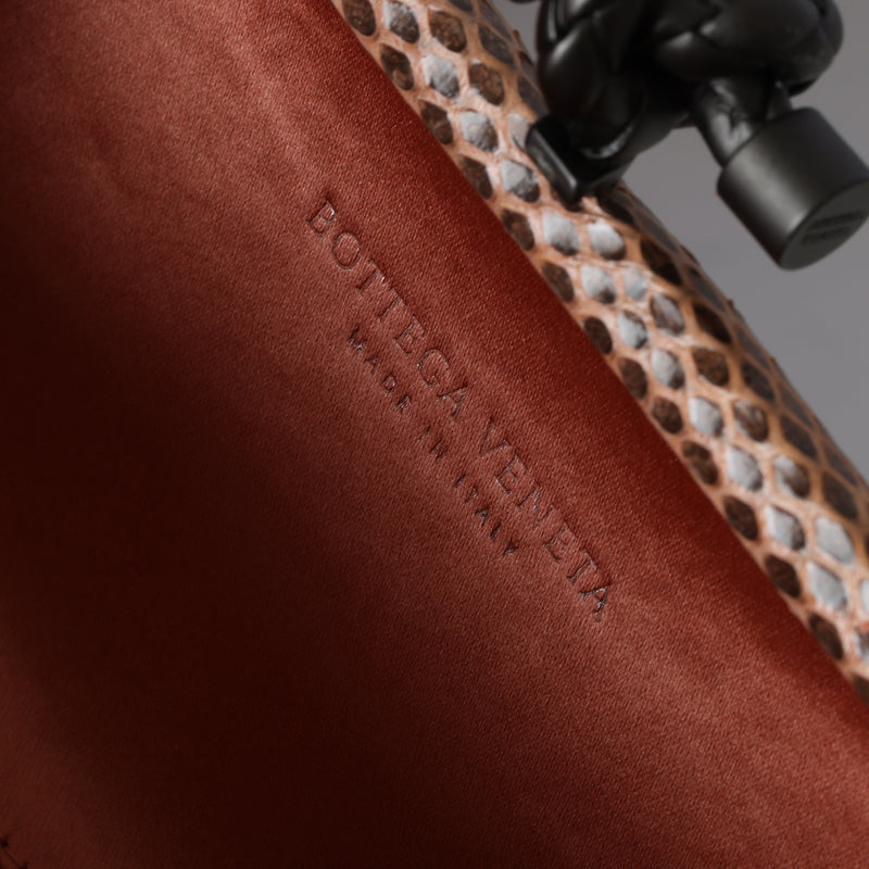 Knot padded Intrecciato Leather Clutch - Orange