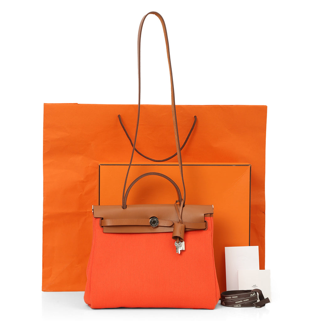Shop Preloved Hermès Orange Herbag 31, crafted in canvas and